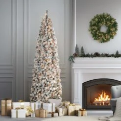 9 Ft. Pre-Lit Acacia Flocked Slim Tree With Clear Lights 14 9 Ft. Pre-Lit Acacia Flocked Slim Tree With Clear Lights -Christmas Trees Sales AC100 300 90F SLifestyle1 d516f0c0 90a3 4070 b0be 9d12680ea4f7